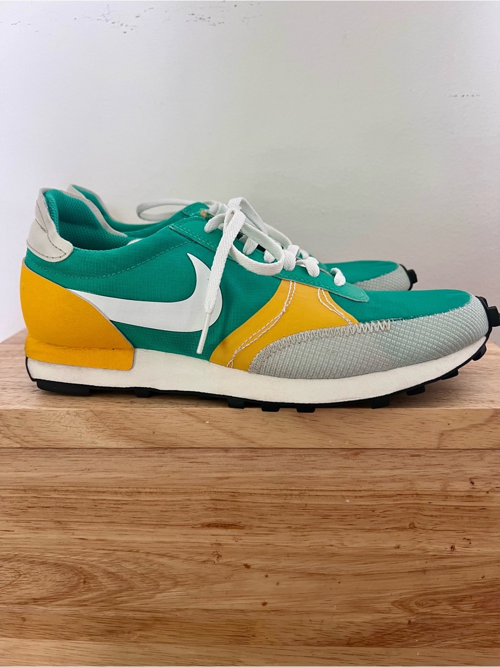 Nike Daybreak Type SE sneakers in the "Stadium Green University Gold" colorway.